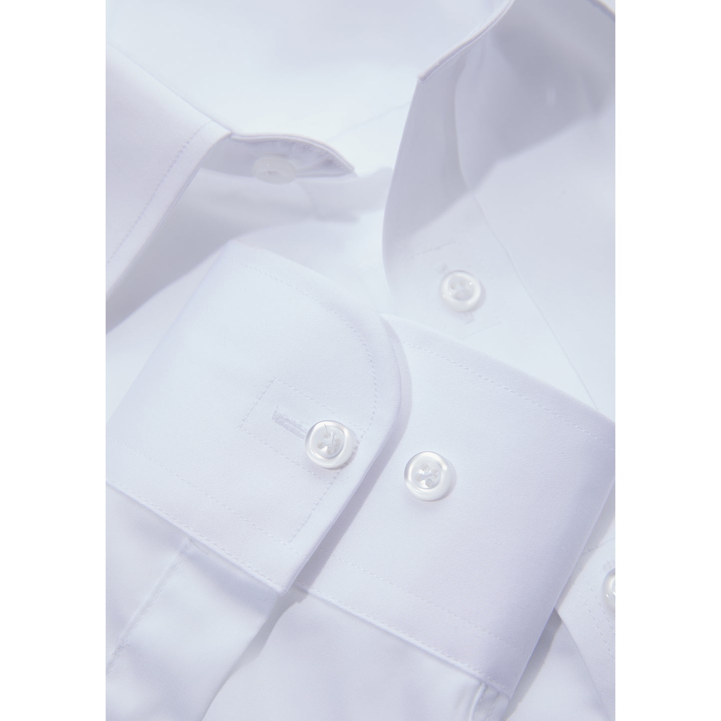 Close-up of white shirt neck line and cuff